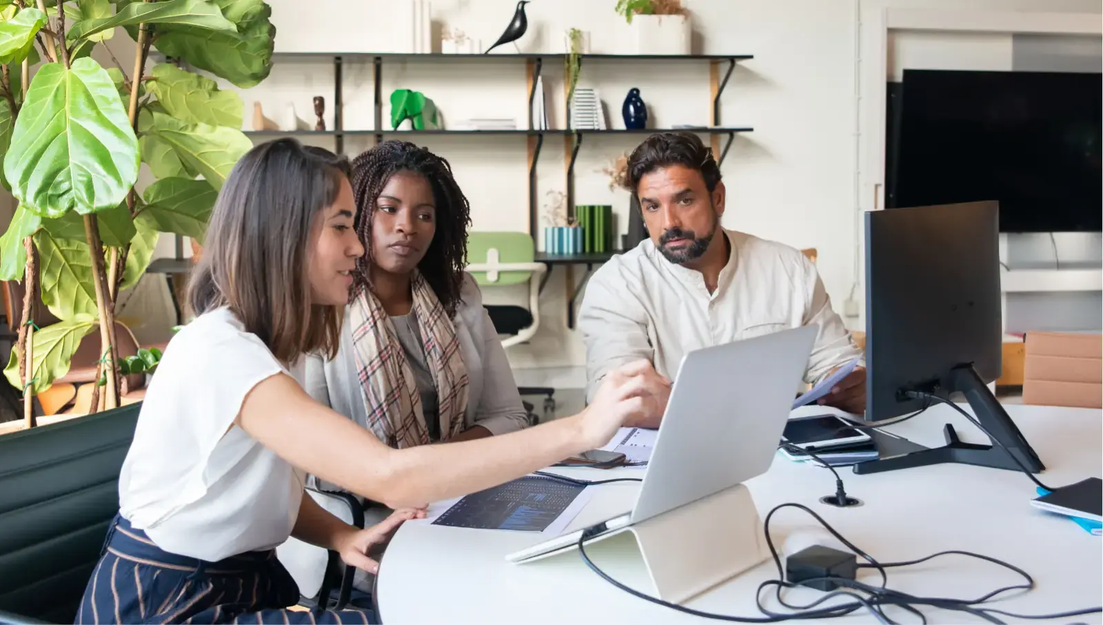 Build a Market-Ready MVP Without Overbuilding Small team reviewing user feedback on a laptop
