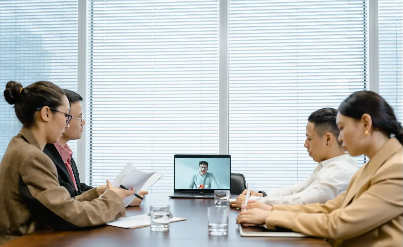 Two people on a video call on a laptop