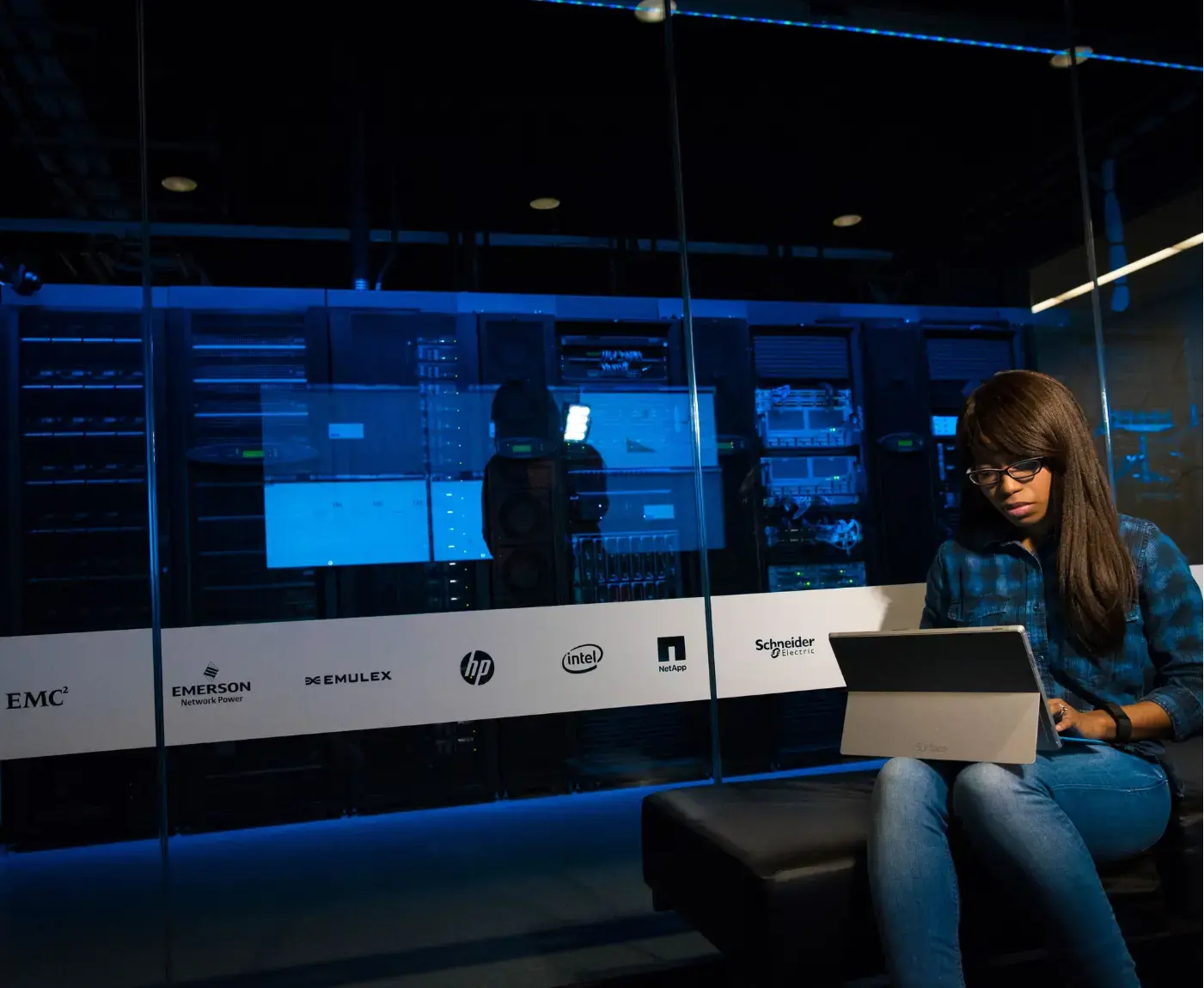 Team IT engineer working at a server rack